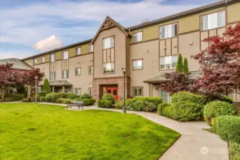 Large grassy open area with your secure building entrance! Great for your 4 legged Family members!