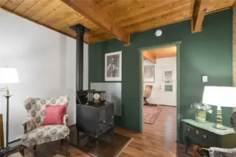 Newer wood burning fireplace in living room, entry door is to the bedroom