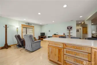 Set up for small gatherings, this common area could also be used a designated dining room.  View from the kitchen.