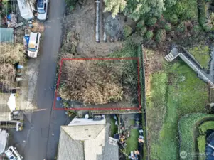 What a quaint little lot offering a possible low maintenance yard once built out.