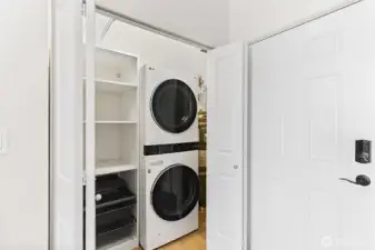 Laundry room with stacked W/D + extra shelving