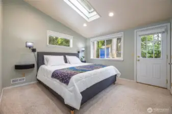Upstairs is the primary suite, with vaulted ceilings. Light and bright.