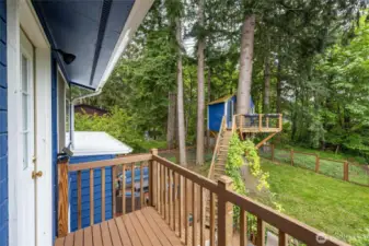 The primary bedroom has a small deck overlooking the awesome backyard.