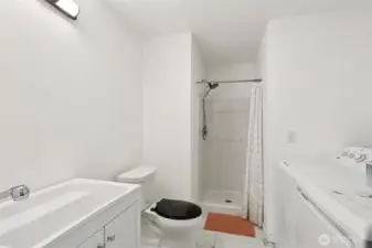 Lower Level Bathroom (3rd in Property) complete with Washer and Dryer and Walk-In Shower