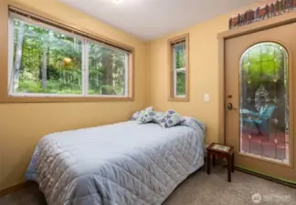 First level bedroom with door to secluded back deck