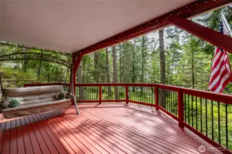 A wonderful covered deck for lounging in the afternoon