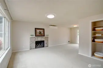 Bright Living Room with fresh interior paint, new carpet, and ductless heat pump for year-round comfort,