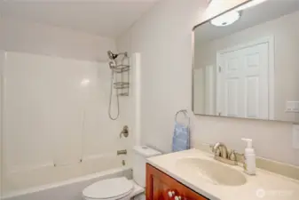 Continental Bath with convenient dual access from hallway and primary bedroom