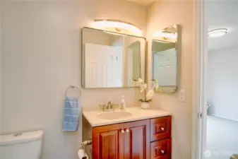 Clean, refreshed bathroom with dual entry - perfect or guests and private access from the primary bedroom