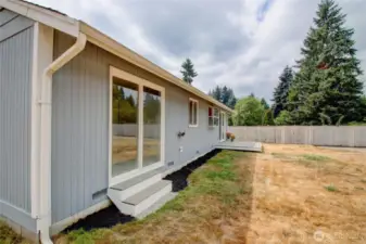 Enjoy backyard access from the Primary slider with brand-new steps
