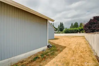 Double opening side yard gate gives easy access to backyard