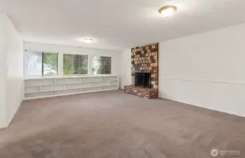 nice size bonus room with lots of light and wood buring fire place.