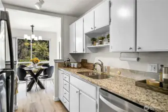 Plenty of storage in this galley style kitchen with new stainless appliances
