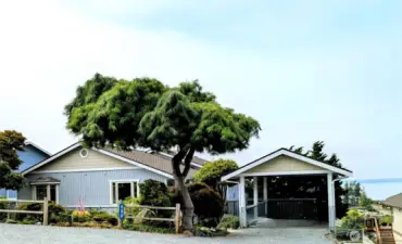 In addition to the 2 car garage, there is a carport/boathouse for extra covered parking.