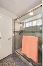 Completely updated tile shower in the primary bedroom.