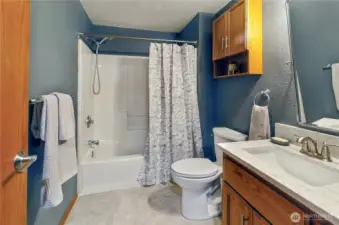 Crisp, clean, and convenient - remodeled hall bath offers easy access for family or guests