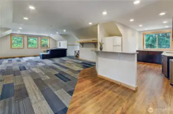 A self-contained office retreat featuring a kitchenette and ¾ bath on the second level