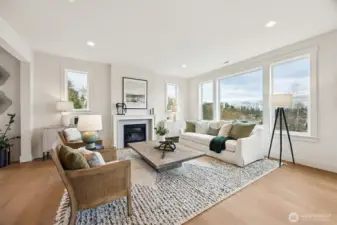 Open, light and bright living room with expansive windows backing to protected space. Beautiful mountain and territorial views.