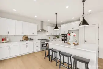 Photo of kitchen, model home on lot 4 at Moorlands Grove. Stunning mountain and territorial views. Home backs to protected space.