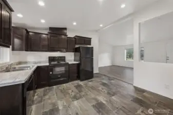 This is where function quietly shows off. The kitchen cutout creates visual connection to the living room without going full open concept chaos. The half wall underneath is prime real estate for seating, added counter space, or a casual work zone. With recessed lighting overhead and easy sightlines throughout, this layout feels flexible, modern, and surprisingly thoughtful. Or if you’re not in the mood to cook, stroll just a few blocks past the post office to Joe’s Place, a historic 113-year-old family business providing a delicious menu of American foods and karaoke on the weekends.