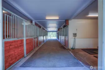 As you enter the barn you will be wowed! There are seven - 12 X 12 matted stalls, wash rack & tack room. You will notice the the gaveled center aisle for safety when training foals, but pavers could easily be added.