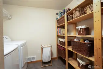 Spacious utility room with tile flooring.