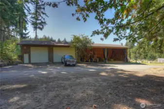 24 X 100 conventional wood construction hay barn/equipment/garage/workshop with foundation and NEW ROOF - December 2025. 24 X 60 X 16 hay/equipment storage - plenty of room for 30 tons of hay!  24 x 40 X 13.4 garage/workshop concrete floors. one door is 12 X 11'7" and one door is 18 X 11'7" + wired for welding and air compressor.