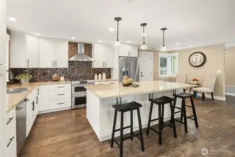 Fresh trim and craftsman doors, and LVP flooring throughout. Newer Milgard Tuscany vinyl windows, two-way blinds, newer 95% efficiency furnace and water heater. Newer outlets, fixtures and recessed lighting.