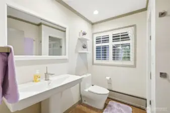 Adjacent 3/4 bathroom to view guest bedroom and functions as main floor powder bathroom.