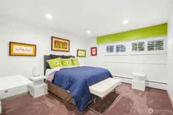 This bedroom looks out to front of house and uses it's own adjacent bathroom.