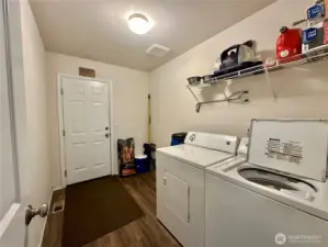 Laundry off kitchen leading into garage