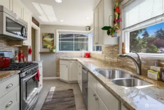 Kitchen has abundance of light and counter space.