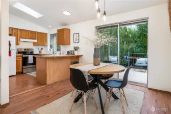 The dining room is adjacent to the kitchen and enjoys access to the deck.