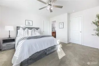 Primary bedroom with ceiling fan upgrade also has ensuite bathroom and a walk-in closet!