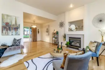 This view showing the living room, dining room and large slider to the covered back deck and backyard.