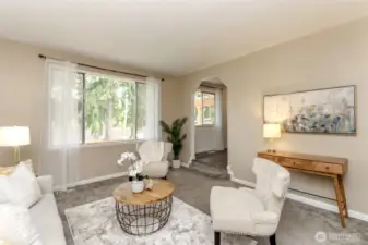 The large windows face the backyard.