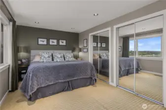 You're going to be captivated by the Primary Bedroom Views; they are Incredible…definitely the Most Impressive Views in the Home!  Rise and Shine, Invigorated and Refreshed by this Breathtaking View! From this angle, you can see a small peek of the View through the mirrors. The Large Windows perfectly frame and maximize this Incredible View. The photos gives you a good idea, but they can't convey the feeling of actually being there. You really must see it in person!