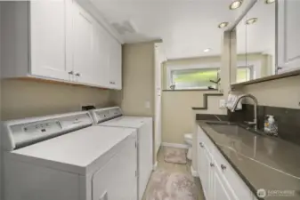 The Laundry/Utility is also fully updated with Quartz, Lots of Storage Cabinets and a Utility Sink! The Shower was taken out, but the plumbing is still intact in case you desire another shower or other changes.