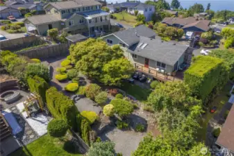Ariel view of the back yard. The overall impression is one of peace and harmony, a serene oasis within a suburban landscape.
