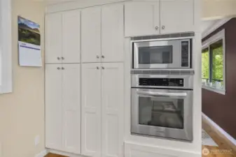 Well-appointed with Cabinetry Galore, this Gourmet Kitchen allows for Excellent Organization of your Culinary Tools and Ingredients! Pictured here on the left are 2 Pantry Cabinets with Pull-Out Shelves.
