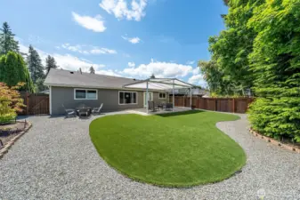 Enjoy year-round outdoor living with low-maintenance artificial turf and a thoughtfully designed outdoor space, it's the perfect setting for both everyday relaxation and effortless entertaining.