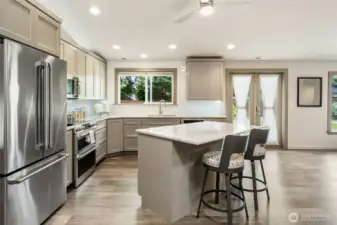 French doors open directly to the backyard patio, creating a seamless flow between indoor and outdoor spaces—ideal for entertaining. With the kitchen perfectly positioned nearby, hosting gatherings becomes effortless and inviting.
