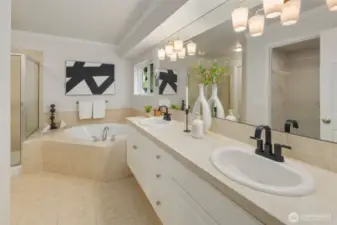 Relax and unwind in the spa-inspired primary bath, featuring a jetted soaking tub, separate walk-in shower, and coordinated tile flooring, counters, and surround. A generous layout and thoughtful finishes offer a sense of everyday luxury. The spa-like primary bath includes a jetted tub, walk-in shower, and a private water closet with a newly toilet—offering added comfort and privacy within this elegant retreat. The spacious walk-in closet offers generous shelving and hanging space, making it easy to stay organized and keep your wardrobe within easy reach.