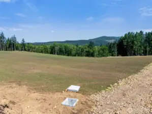 Looking Northwest. Electrical Vault in foreground.