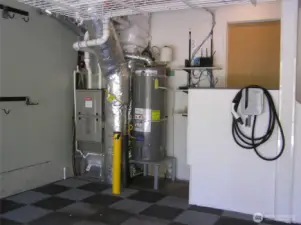 Gas heat and hot water are in garage. Car charger is ready to start charging.