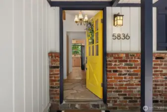 Step into your quaint island cottage perfectly situated up a private drive on a sunny lot.