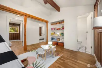 Flex space with view of powder room.