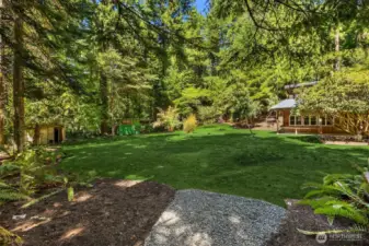 Large shop off of the back yard allows for one to hone their craft or turn it into a guest space.