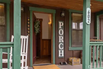 The cutest front porch, entry way.