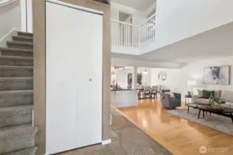 Vaulted ceilings welcome you -- then, the family room / office is to the left and the living room & dining rooms are to the right. (Go either direction to reach the kitchen at the back of the house overlooking the backyard!)